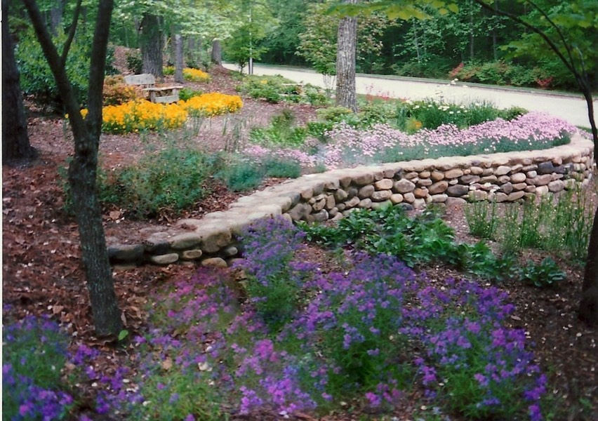 Low Curved river rock low stone wall